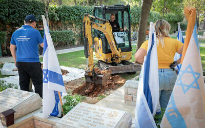 Graves prepared at the Mount Herzl military cemetery in Jerusalem, October 8, 2023. (Noam Revkin Fenton/Flash90