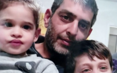 Avigail Idan (left) 3, here with her father Roye and brother Michael, was taken captive by Hamas terrorists on October 7, 2023 from Kibbutz Kfar Aza (Courtesy)