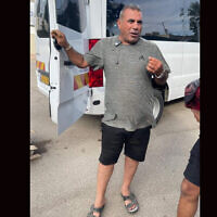 Youssef Ziadna, an Arab Bedouin from the Israeli city of Rahat, shows off his minibus in which he reportedly saved 30 attendees of the Nova dance party after it was attacked by Hamas on October 7, 2023. (Courtesy Ziadna via JTA)