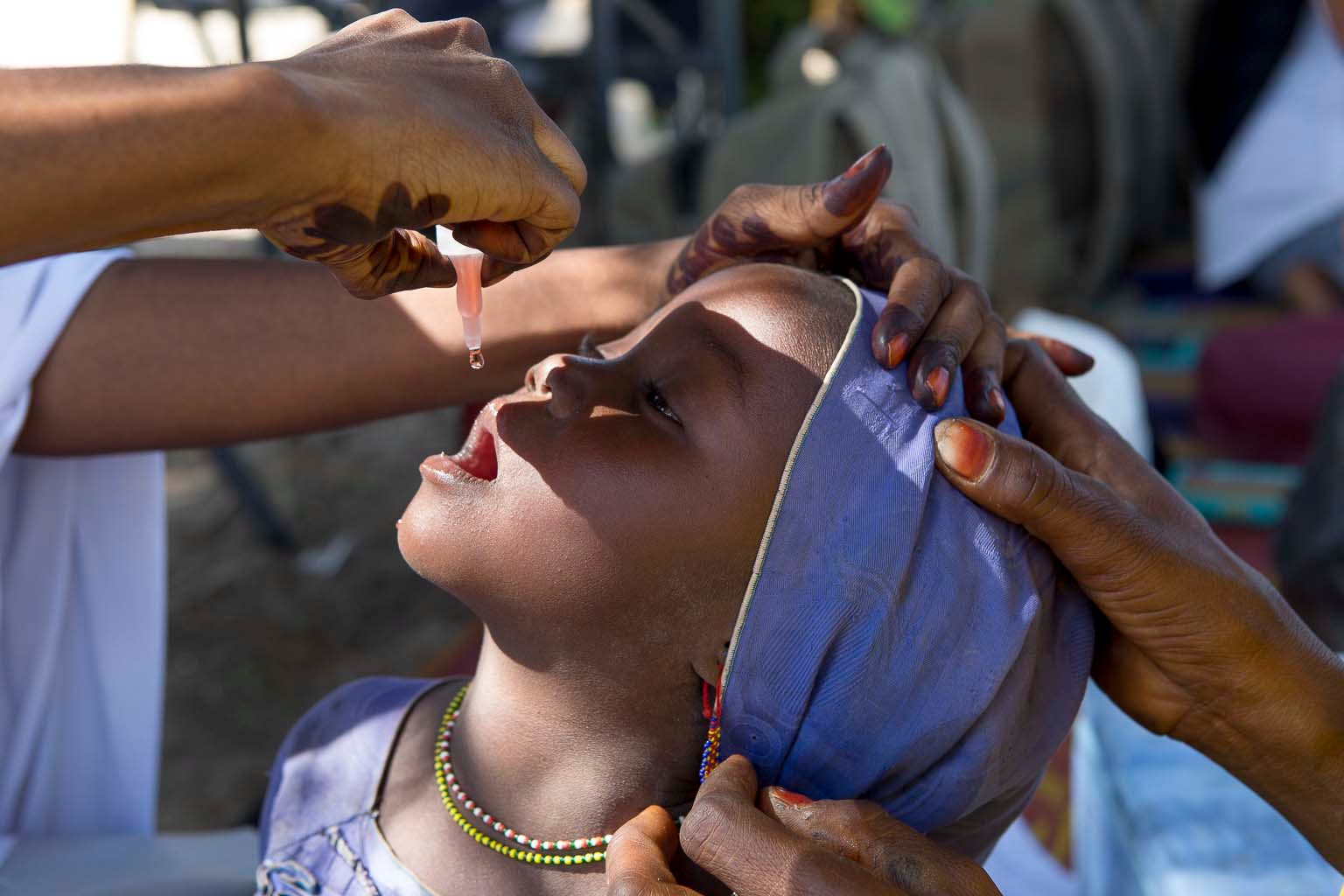 A child is being vaccinated orally in Borno state, Nigeria