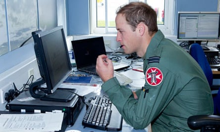 Prince William sits at a computer
