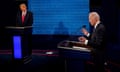 Joe Biden answers a question as Donald Trump listens during the second and final presidential debate in Nashville, Tennessee, on 22 October 2020.