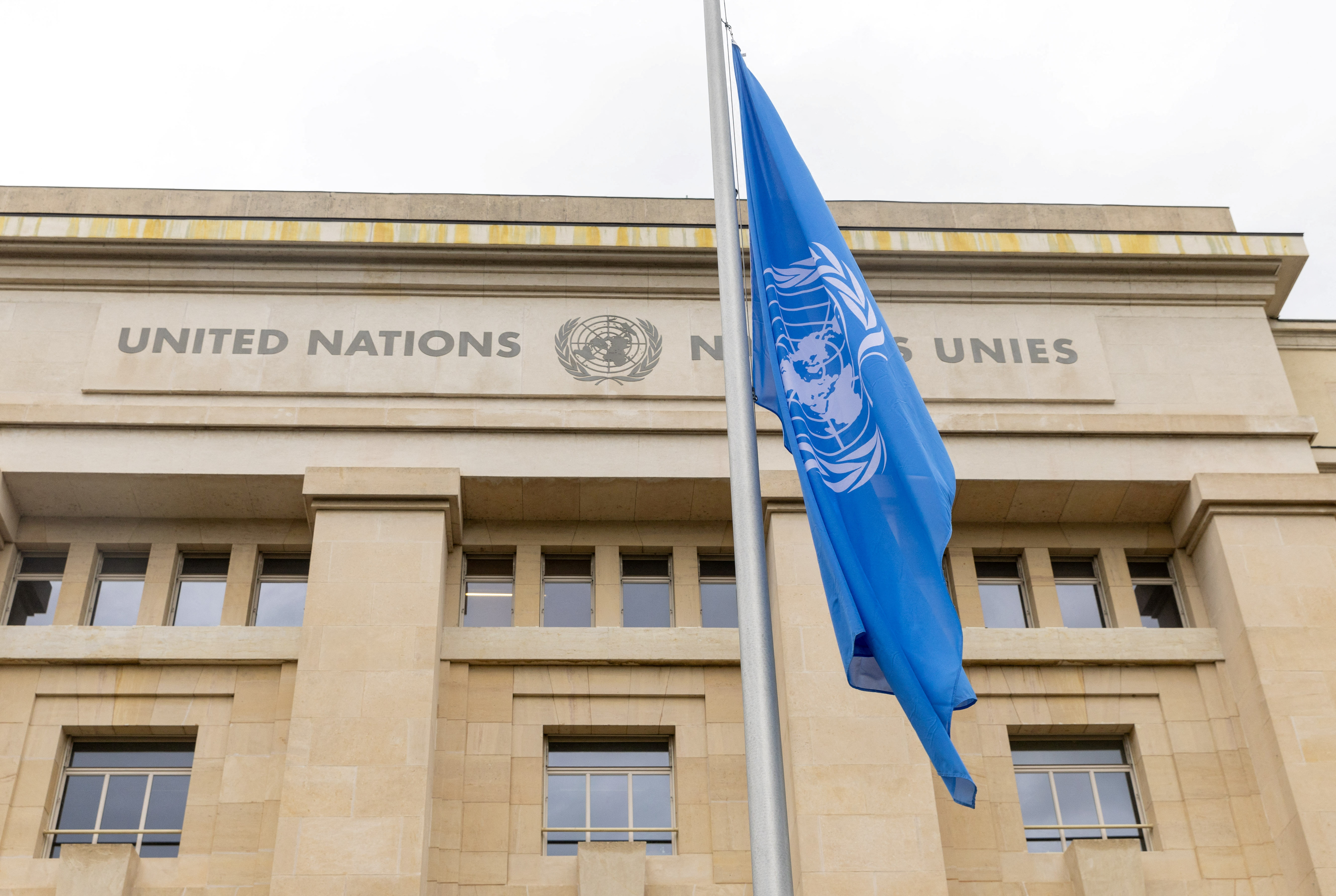 The United Nations flag flies at half-mast at the European headquarters in Geneva