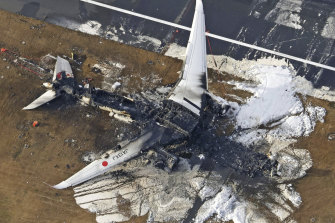 The burnt out Japan Airlines plane that collided with another aircraft on Tuesday evening. All 379 passengers and crew safely evacuated, though five people on board the other plane were killed.