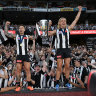 Collingwood’s Jamie Elliott and Darcy Moore celebrate their premiership victory. Fans want loyalty among their sporting stars but it’s no good as a consumer.