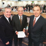 Then Irish prime minister Bertie Ahern, US senator George Mitchell and British prime minister Tony Blair pose after signing the Good Friday Agreement for peace in Northern Ireland in 1998.
