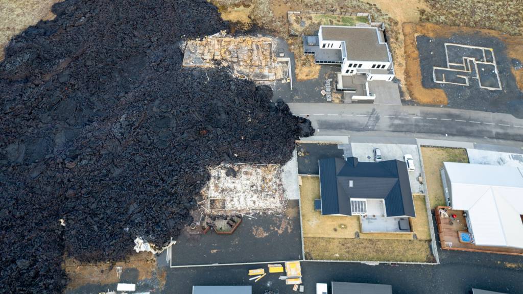 Image taken with a drone showing destroyed builings following lava explosions after a volcanic eruption near the town of Grindavik, in the Reykjanes peninsula, southwestern Iceland, 15 January 2024