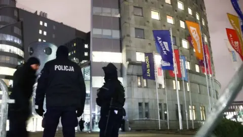 Police takes security measures in front of the public tv channel TVP headquarters in Warsaw, Poland on 21 December 2023.
