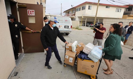 Volunteers deliver supplies to the St Anthony Croatian Catholic Church, where migrants were taken to after arriving at Union Station in LA.