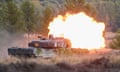 A Leopard 2 tank fires during training at a military base in 2022. Germany’s Manfred Weber has suggested the EU should take over from Nato in defending the continent.
