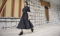 A model wears Christian Dior on the runway at Couture Spring 2024 in Paris.