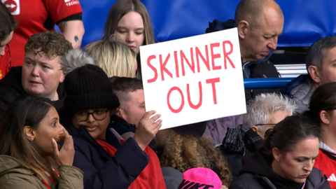 A placard reading "Skinner out" at Chelsea v Man Utd"