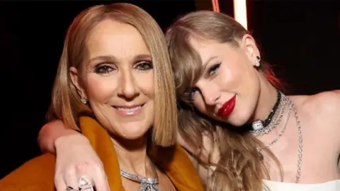 Celine Dion and Taylor Swift hugging backstage at the Grammys
