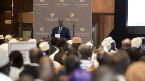 Senegal's President Macky Sall (C) delivers a speeh during the National Dialogue in Diamniadio on February 26, 2024. 