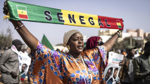 A demonstrator holds a scarf during a march in Dakar, Senegal on March 2, 2024, against the new amnesty law and for elections to be held before April 2, 2024. 