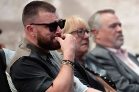 Philadelphia Eagles' Jason Kelce's family, from left, Kansas City Chiefs' Travis Kelce; mother, Donna Kelce; father, Ed Kelce; and wife, Kylie McDevitt Kelce, listens as Jason Kelce announces his retirement at an NFL football press conference in Philadelphia, Monday, March 4, 2024