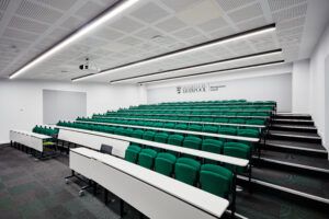 Image of a large seminar room with lecture theatre style seating in the Management School