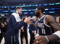 Luka Doncic (l) and Kyrie Irving celebrate after Dallas took a 3-0 series lead against Minnesota. (AP PHOTO)