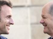 France's Emmanuel Macron and German Chancellor Olaf Scholz have very different leadership styles. (AP PHOTO)