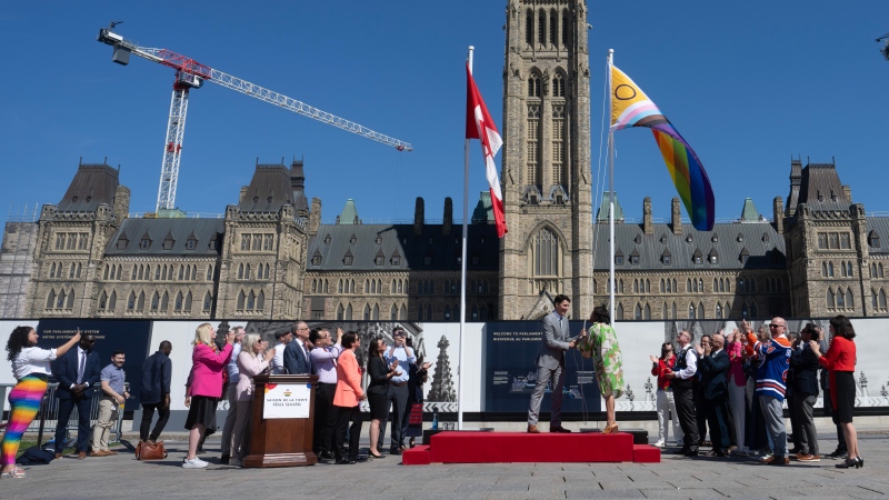 Prime Minister Justin Trudeau and Women and Gender Equality and Youth Minister Marci Ien raise the pride flag during an event on Parliament Hill, in Ottawa, Monday, June 3, 2024. THE CANADIAN PRESS/Adrian Wyld