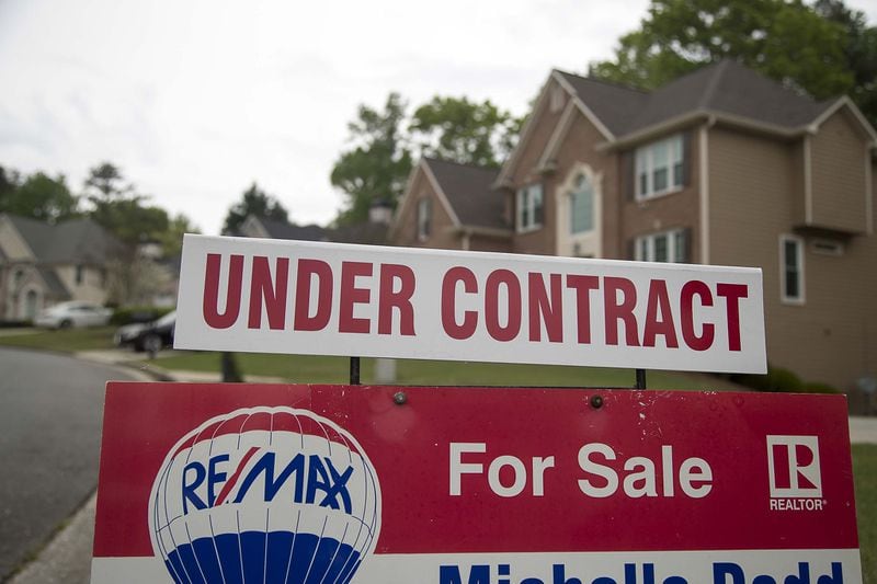 A home for sale sign is displayed in the yard in Powder Springs, Tuesday, April 7, 2020. (ALYSSA POINTER / ALYSSA.POINTER@AJC.COM)