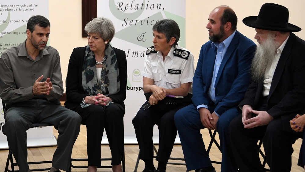 British Prime Minister Theresa May visited met religious leaders near the scene of the attack on June 19 [Stefan Rousseau/Reuters] 