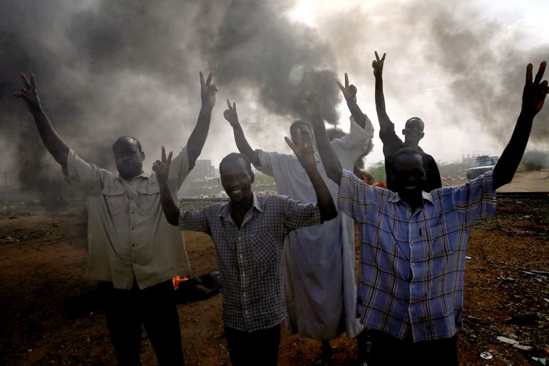 Sudanese protesters gesture as they chant slogans along a street and demanding that the country''s Transitional Military Council hand over power to civilians in Khartoum, Sudan, June 3, 2019. REUTERS/S