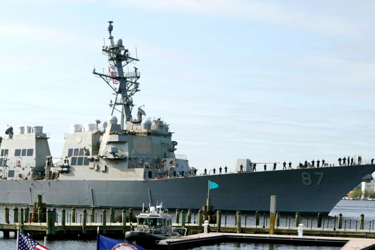 File - The USS Mason, an Arleigh Burke-class destroyer, passes a dock in Norfolk, Va., April 8, 2021. Officials said the USS Mason shot down a suspected Houthi drone flying in its direction during an incident in which two missiles fired from territory held by Yemen's Houthi rebels missed a commercial tanker loaded with jet fuel near the key Bab el-Mandeb Strait on Wednesday.