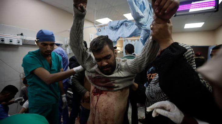 A Palestinian man wounded in the Israeli bombardment of the Gaza Strip receives treatment at the Nasser hospital in Khan Younis, Southern Gaza Strip, Monday, Jan. 22