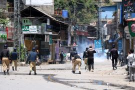 Clashes took place between police and protesters in Muzaffarabad, the capital of Pakistan-administered Kashmir, on Saturday [Amiruddin Mughal/EPA]