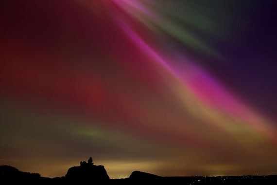 The aurora borealis, also known as the 'northern lights’, are seen over The Roaches near Leek, Staffordshire, Britain