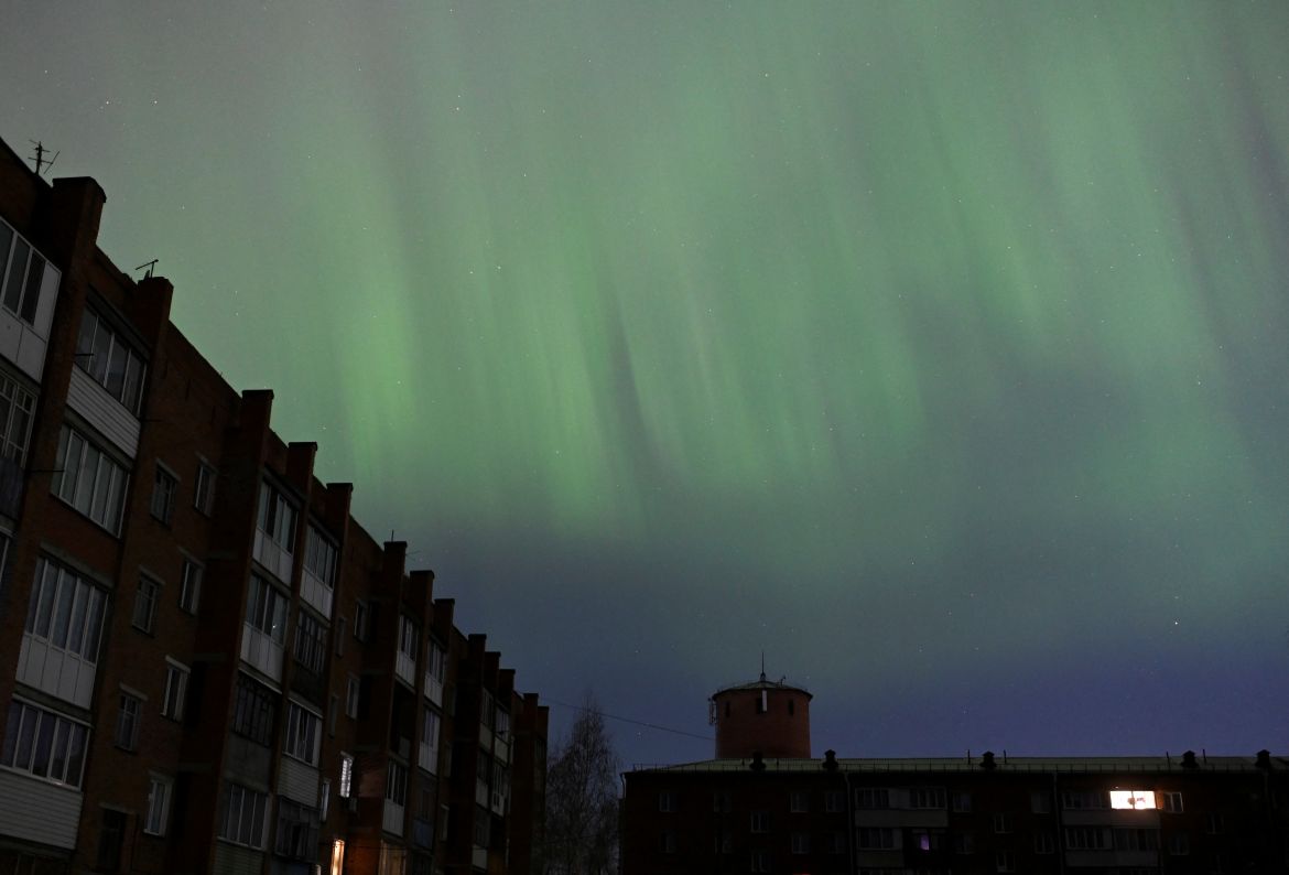 The aurora borealis, also known as the 'northern lights’, caused by a coronal mass ejection on the Sun, illuminate the skies over the southwestern Siberian town of Tara, Omsk region, Russia May 11
