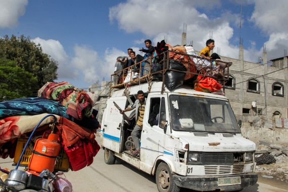 Displaced Palestinians travel in a vehicle as they flee Rafah, after Israeli forces launched a ground and air operation in the eastern part of southern Gaza city