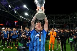Atalanta&#039;s Gianluca Scamacca celebrates with the trophy after winning football&#039;s Europa League Final [Paul Childs/Reuters]