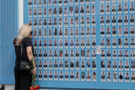 A woman visits the Memory Wall of Fallen Defenders of Ukraine as Ukrainians mark Day of Heroes, amid Russia&#039;s attack on Ukraine, in Kyiv [Gleb Garanich/Reuters]