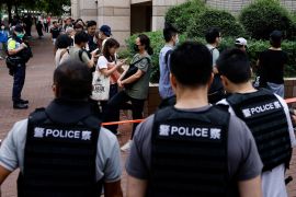There was a heavy police presence outside the court [Tyrone Siu/Reuters]