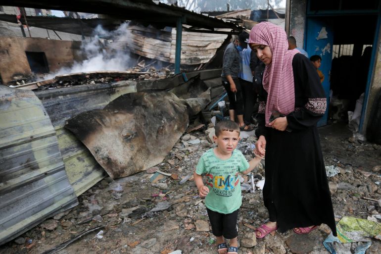 People struggle to survive as Israeli forces attacked a school belonging to the UN agency for Palestinian refugees