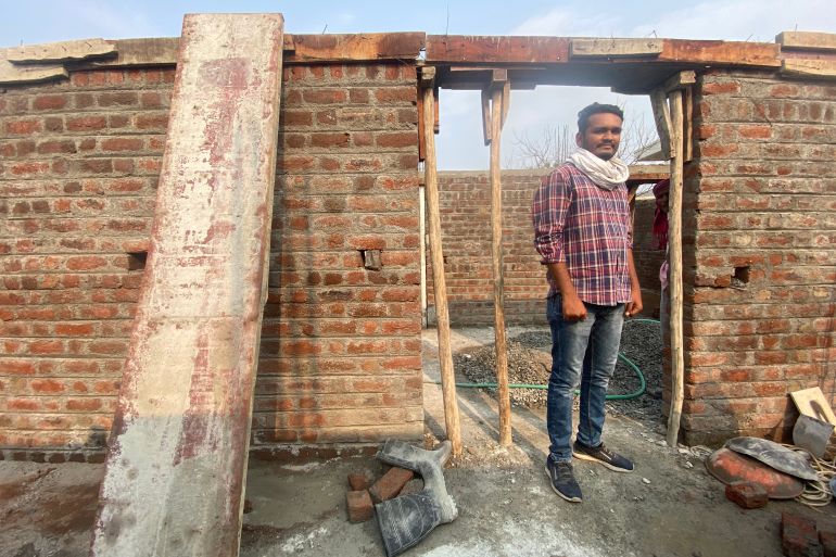 Sidhant Mende has an engineering degree. But he works supervising the construction of a house that requires none of his training and offers a pittance in pay, in Ralegaon, India [Al Jazeera/Kunal Purohit]
