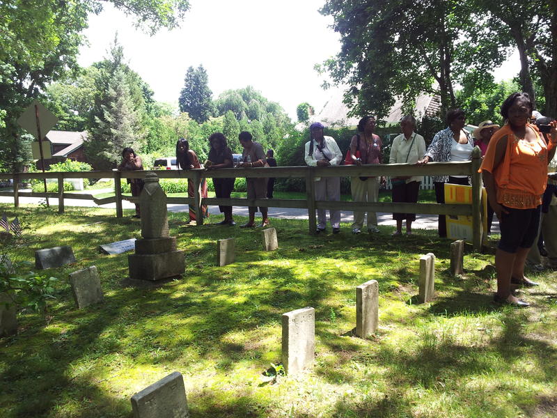 Visitors tour the St. David AME Zion Church Cemetery at Sag Harbor.