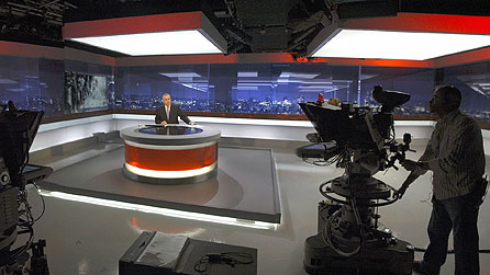 Huw Edwards prepares to present the Ten O'Clock News (image credit: BBC/Jeff Overs)
