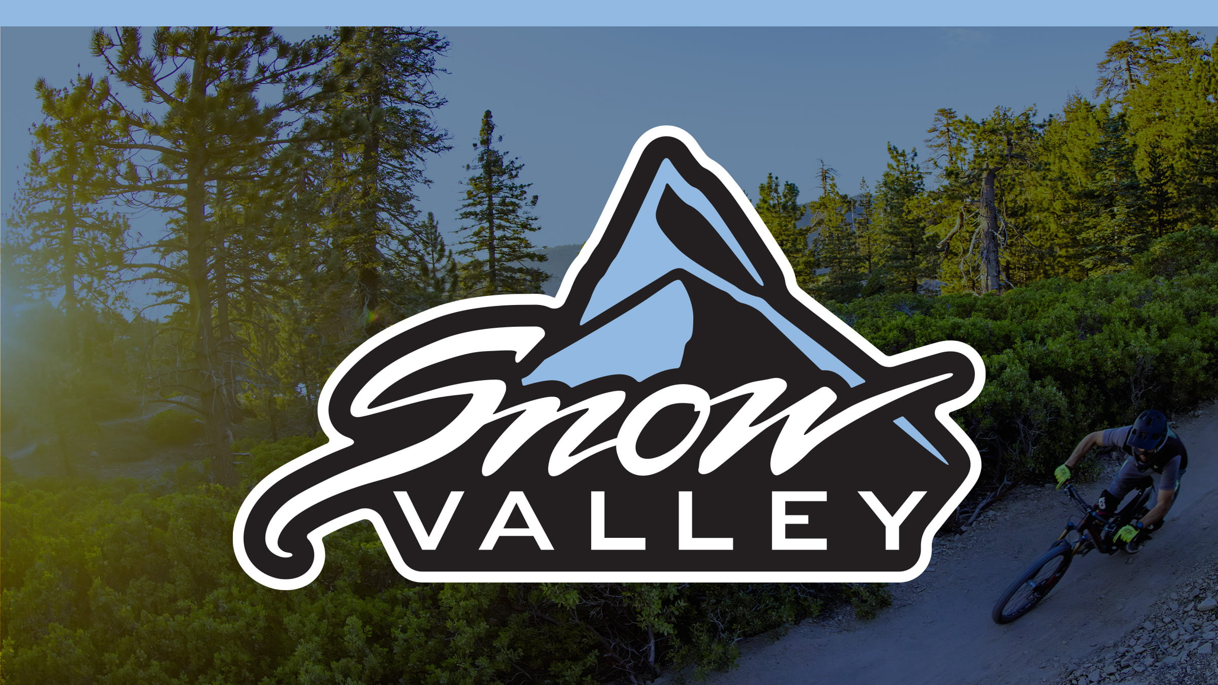 Blue overlay on a bike park image with the Snow Valley logo