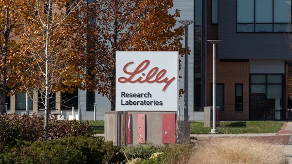 A sign shows the logo of Eli Lilly's Research Laboratories