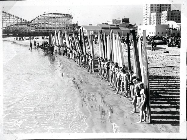 Before the Long Beach breakwater was erected in the 1940s, the city was a surfing destination. Above is a 1938 gathering of what has been called the mainland's first national surf contest. (Courtesy of Ian Lind)