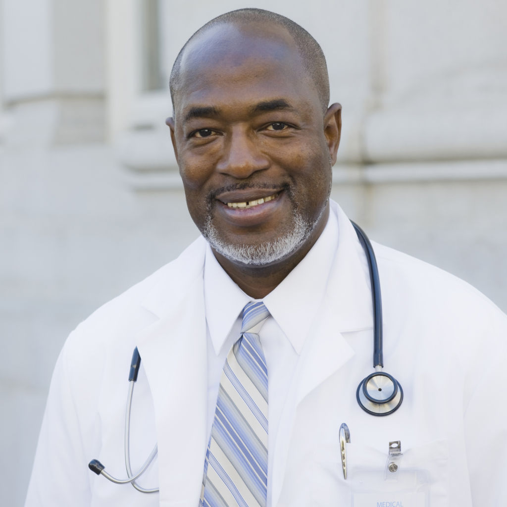 Male Doctor Standing Outside With Stethoscope Around Neck