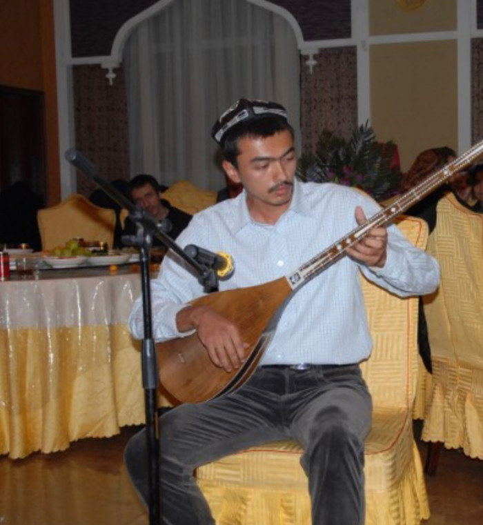 Behram Yarmuhemmed, Gulruy Asqar’s nephew, shown here playing the dutar, a traditional Uighur musical instrument. He was forced into an extrajudicial internment camp in 2016