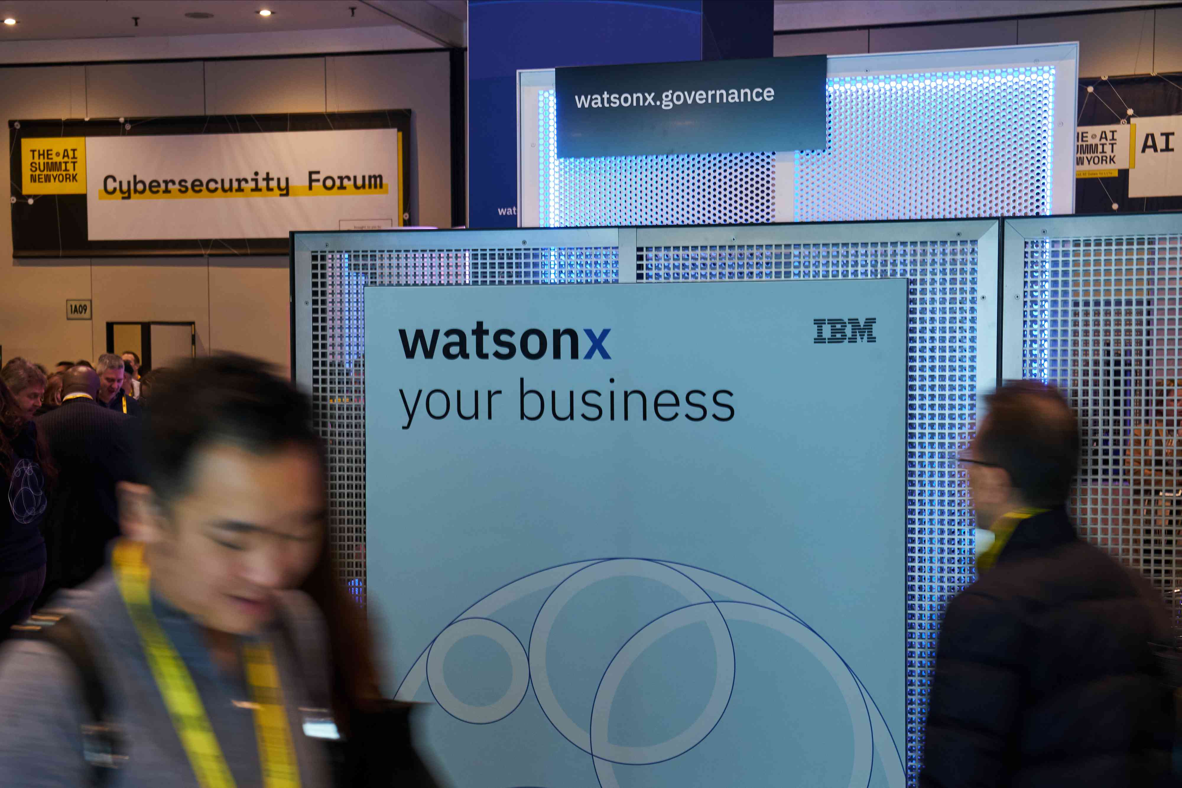 A sign at a conference displays the IBM logo.
