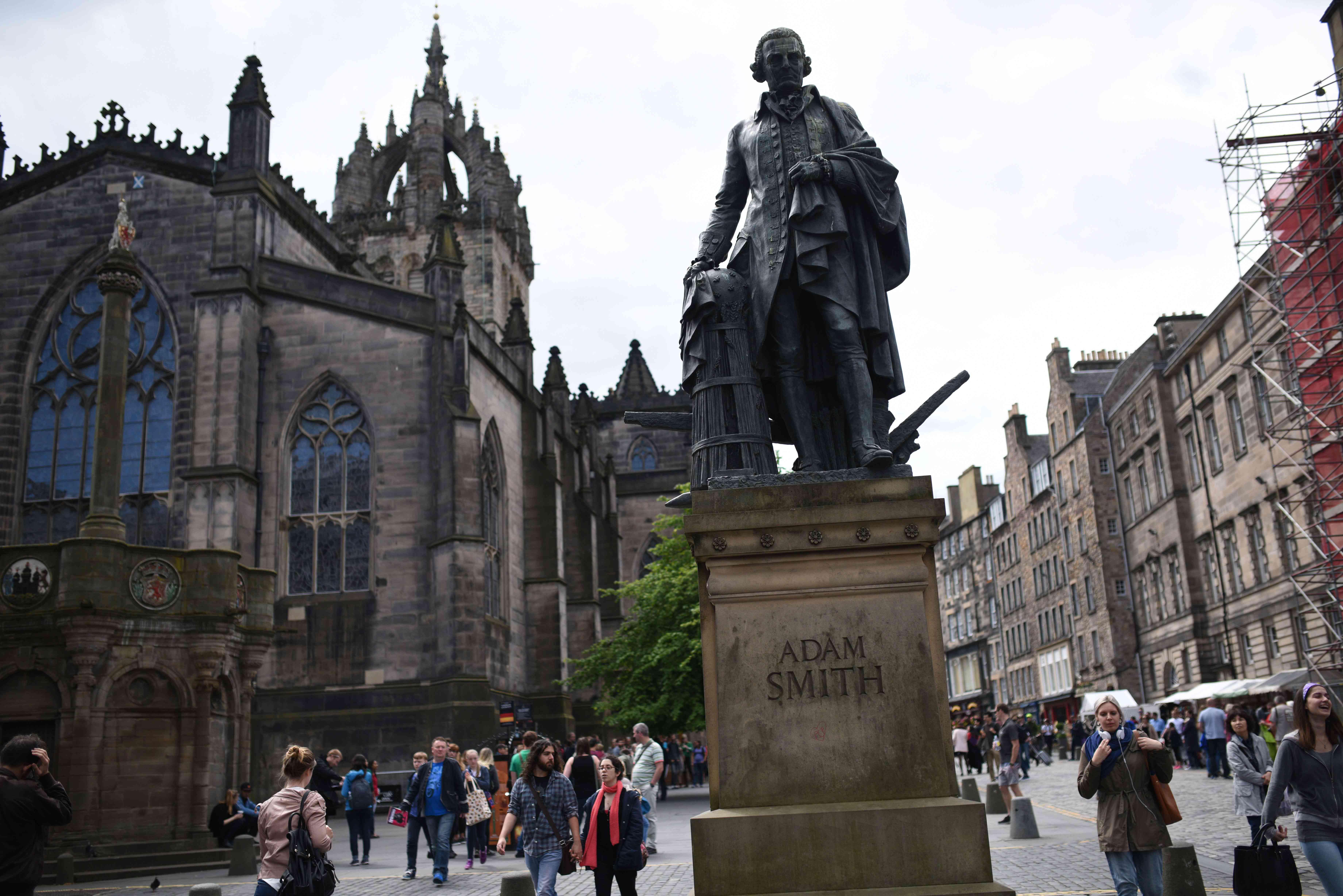 A statue of Scottish economist Adam Smith stands on the Royal Mile in Edinburgh, Scotland 