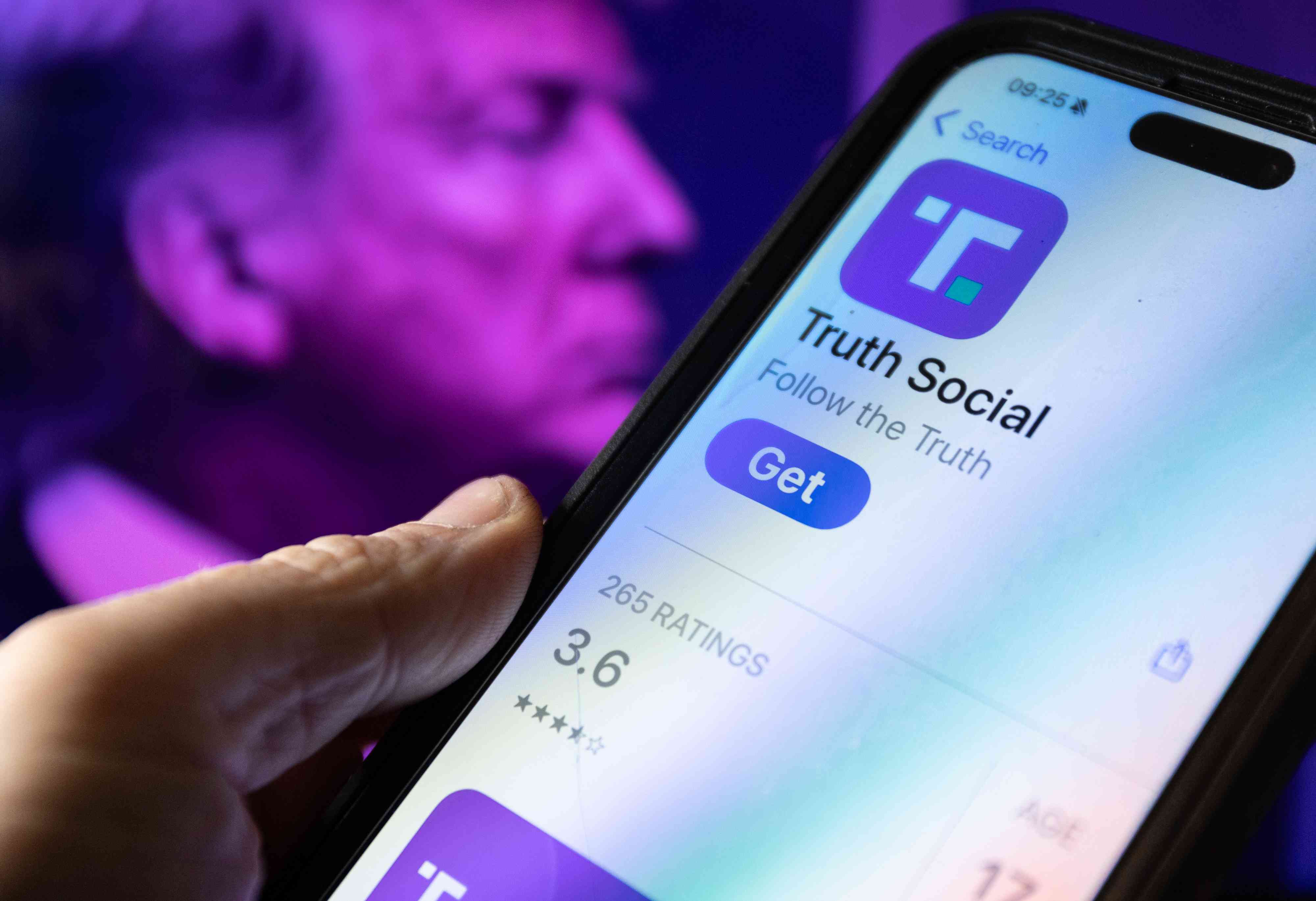 A smartphone screen displays the logo of Donald Trump’s Truth Social app