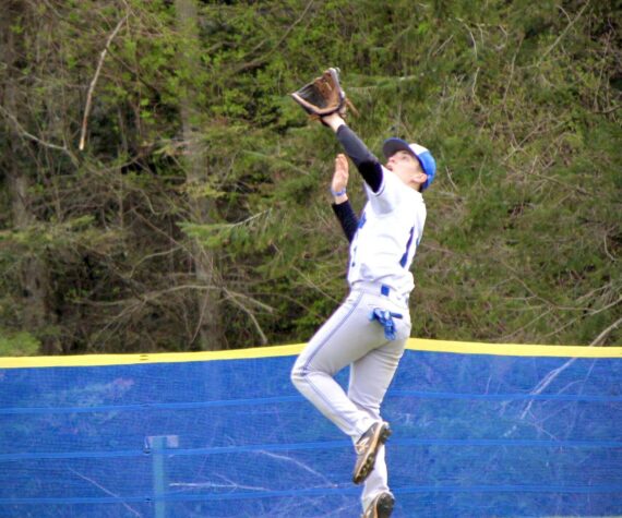 Corey Wiscomb photo.
Orion Meskew catches a deep fly ball.