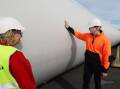 Newcastle MP Sharon Claydon and Energy and Climate Change Minister Chris Bowen inspect a giant wind turbine blade at the Port of Newcastle. Picture by Simone De Peak. 